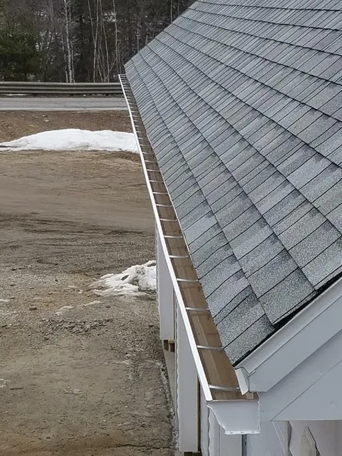 Close-up of seamless gutter and roof edge