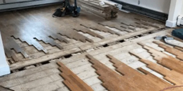 Repairing a damaged hardwood floor.