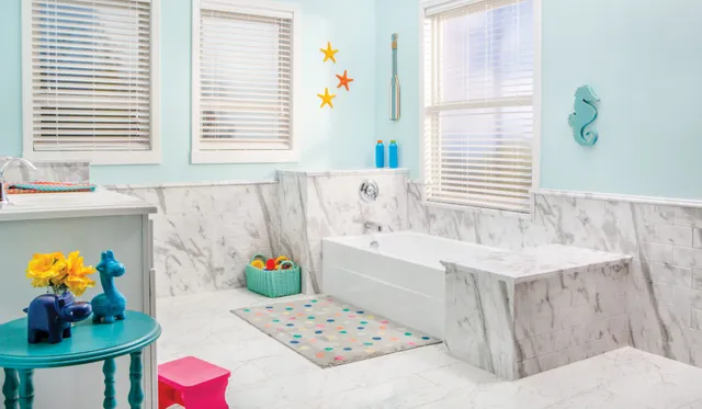 Re-Bath's White Calcutta Contemporary bathroom design featuring White Calcutta DuraBath wall surround, Delux Tub with Moen fittings, and Bertch cabinet in a smooth white finish with Centennial door styling and chrome knobs.
