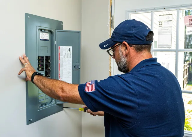 Our electrician, Kenny, finishing up a new panel installation