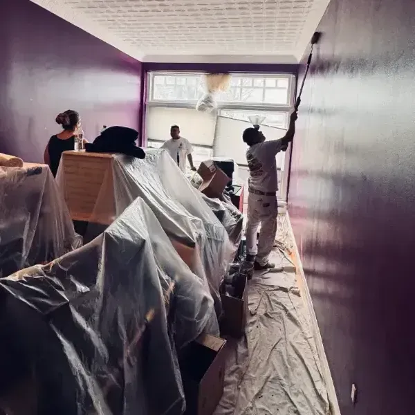 Local painter William Morales painting a home in Waltham, MA.
