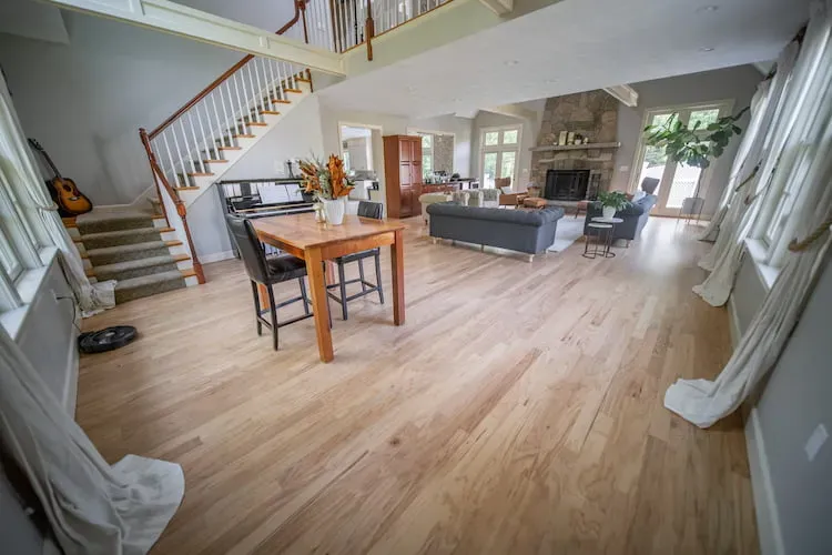 Freshly refinished hardwood floors in a residential living room