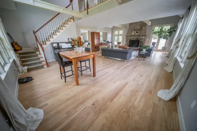 Freshly refinished hardwood floors in a residential living room