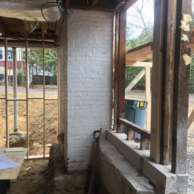 Not everything we do is photogenic. Like this chimney shoring job for instance, is one of many times we have had the pleasure of doing something like this. This project required the chimney foundation in the basement to be removed to make room for the space to be converted into a  two car garage. Working together with the GC, structural engineer, and structural steel contractor, we were able to remove the base of the chimney and transfer the 30’ of chimney onto a structural steel support system. We have done this many times over the years, on smaller and also much larger chimneys. We also install temporary shoring to create or modify masonry openings in masonry buildings, but more on that later.