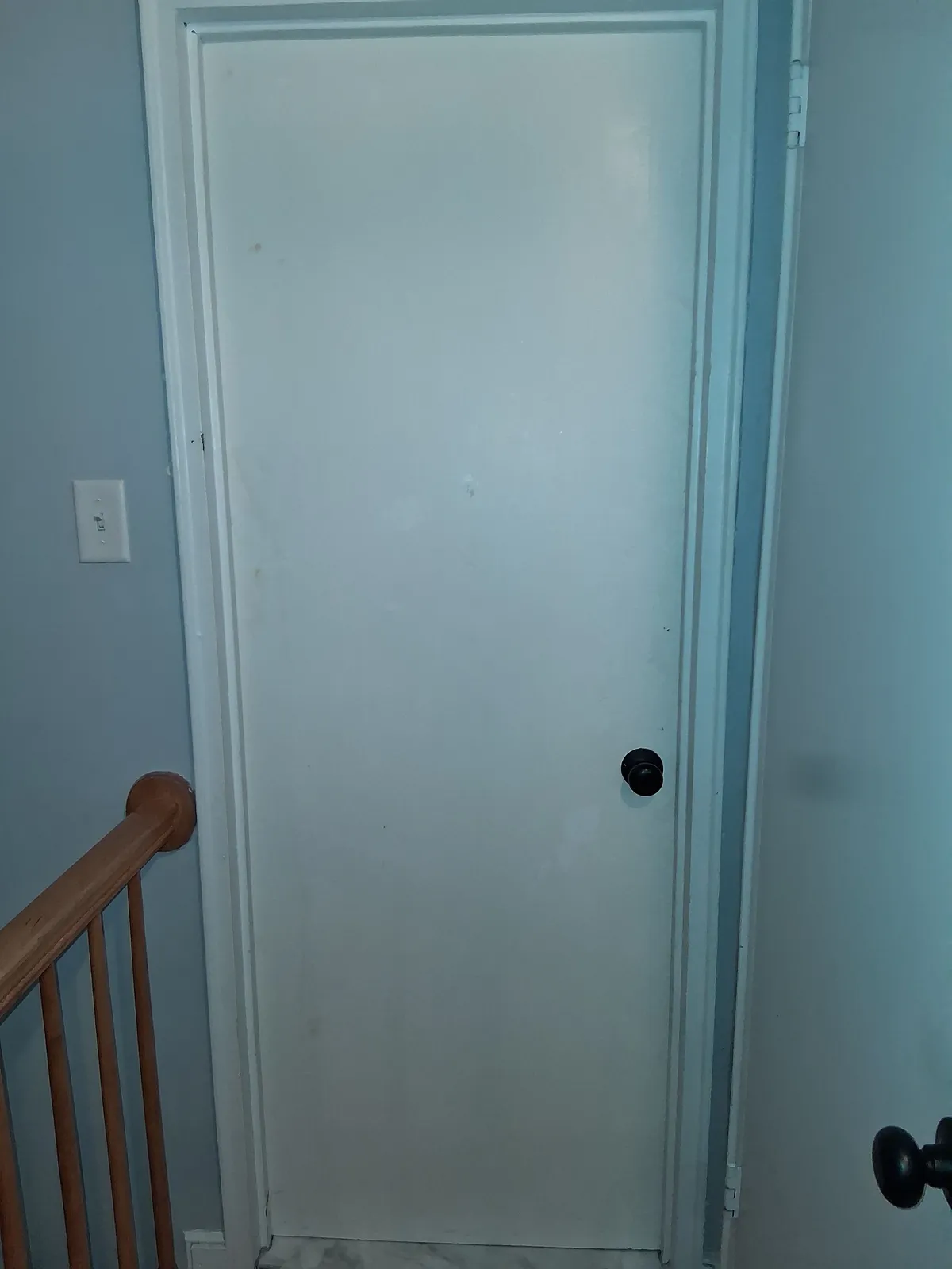 New interior door installed at a stair landing