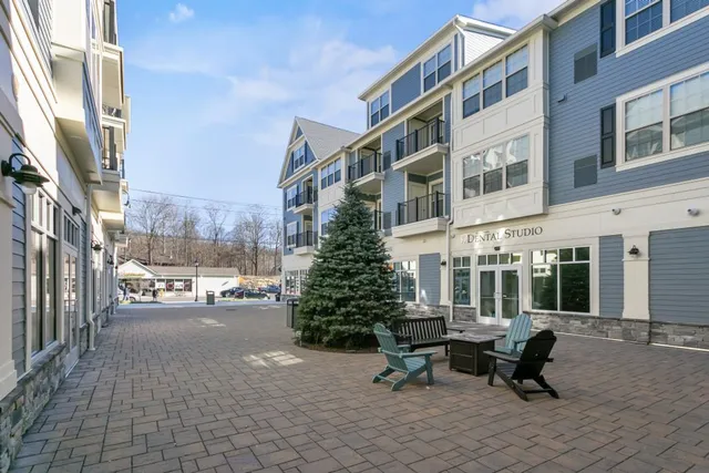 Mixed-use commercial courtyard with exterior trim and storefronts — Brookfield, CT