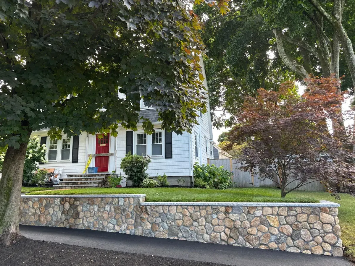Residential retaining wall installation at a Massachusetts home.