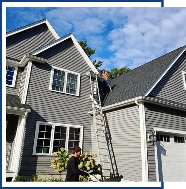 Man At Top Of Roof — Raynham, MA — JDM Siding And Windows