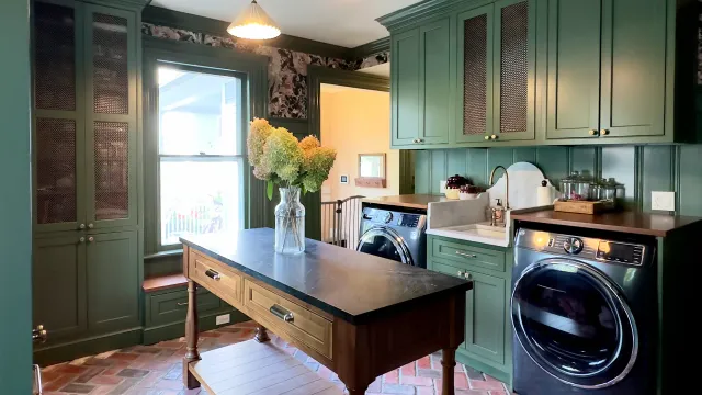 Elegant green laundry room with flowers