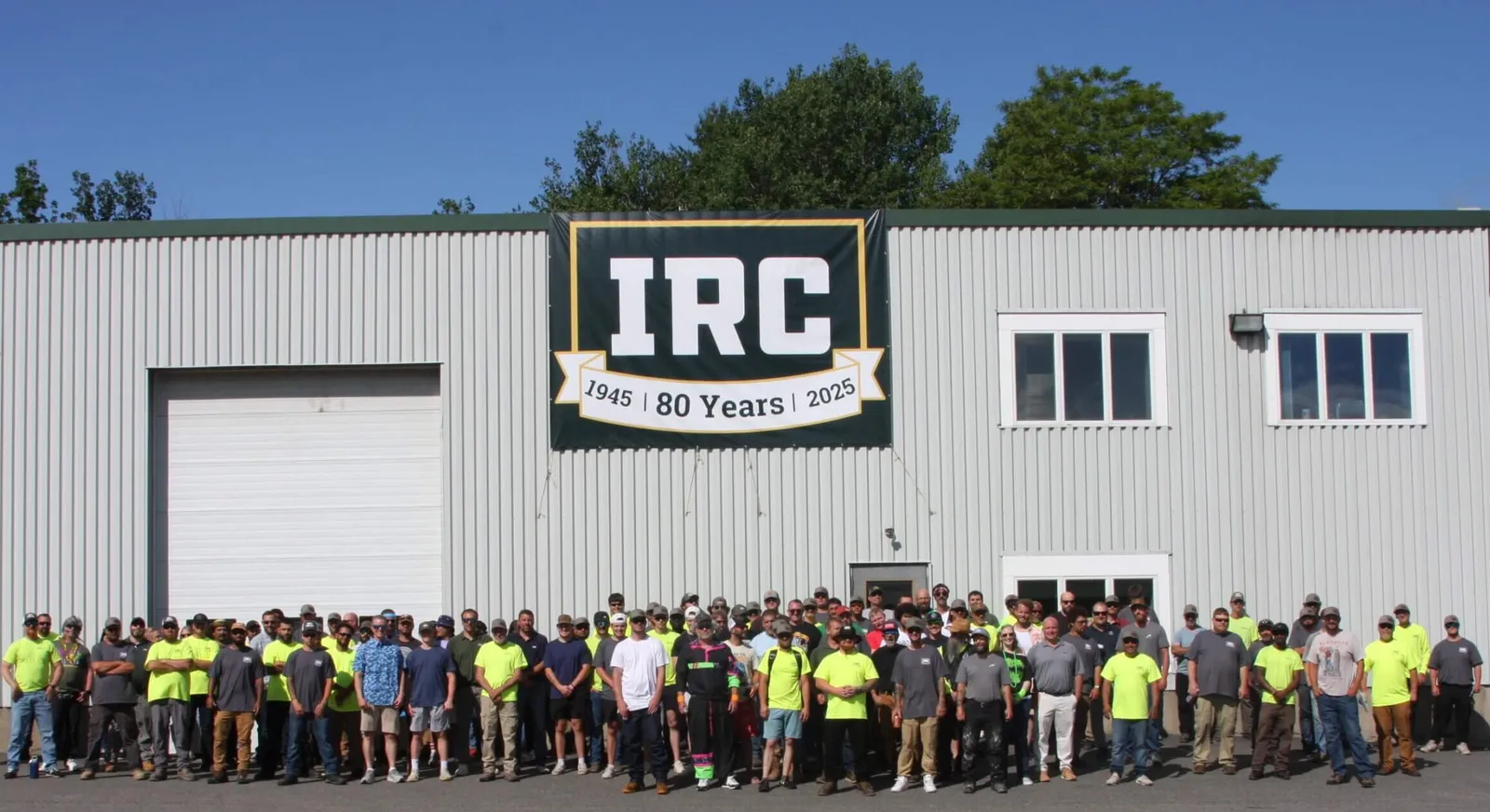 IRC Maine team gathered outside their facility for the company’s 80th anniversary