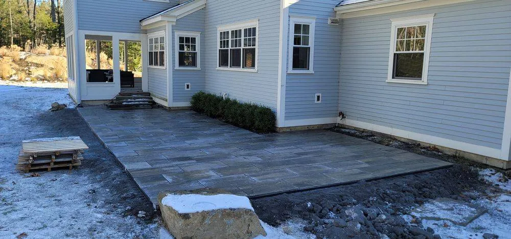 New patio slab alongside house