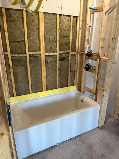 Tub valve and drain rough plumbing installation in bathroom