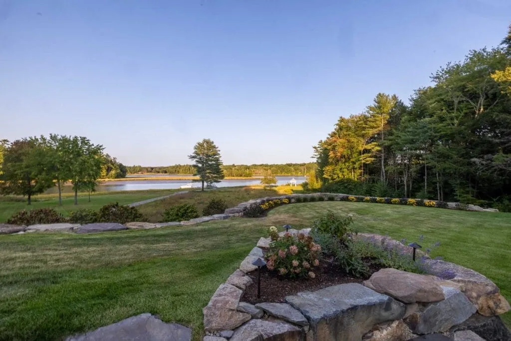 Hampton, NH landscape design: lawn and boulder plantings