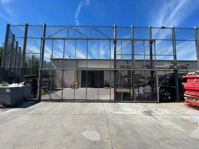 Commercial chain-link fence and gate system installed by Olympic Fence Company in the North Shore.