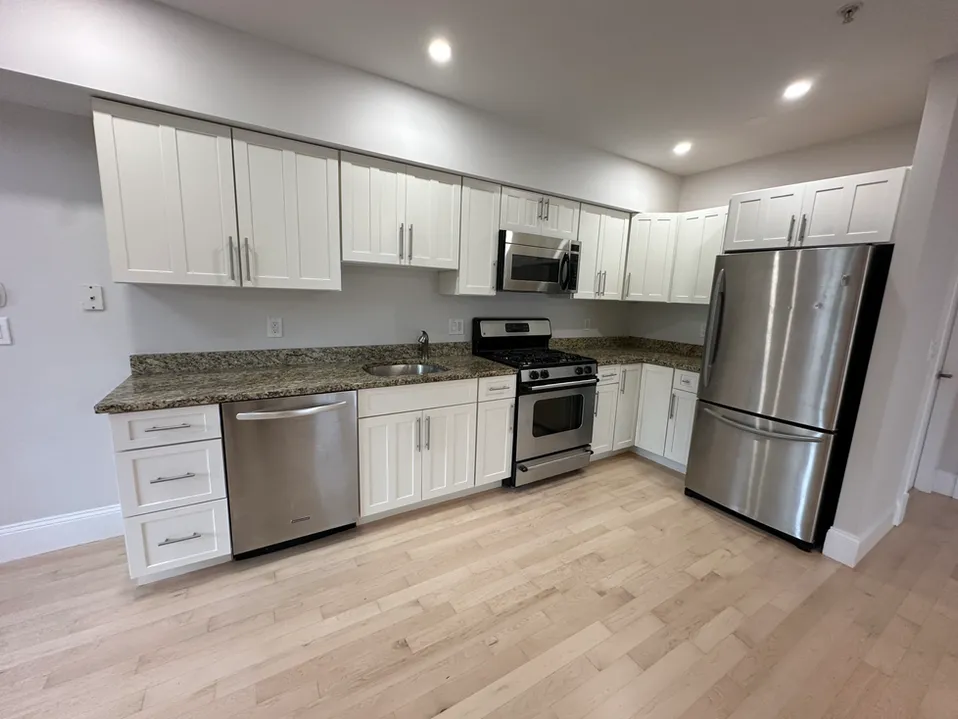 White, modern kitchen in Boston, MA student apartment