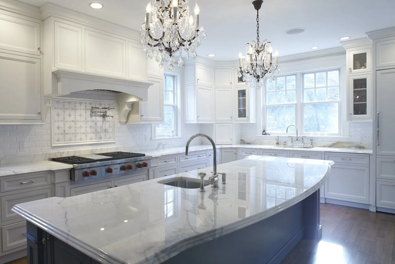 Finished kitchen with island prep sink and pot filler