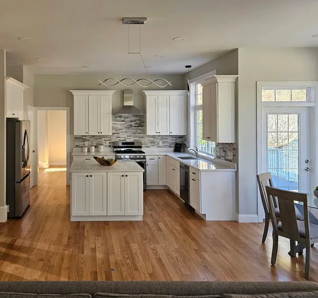 New kitchen with island and tile backsplash