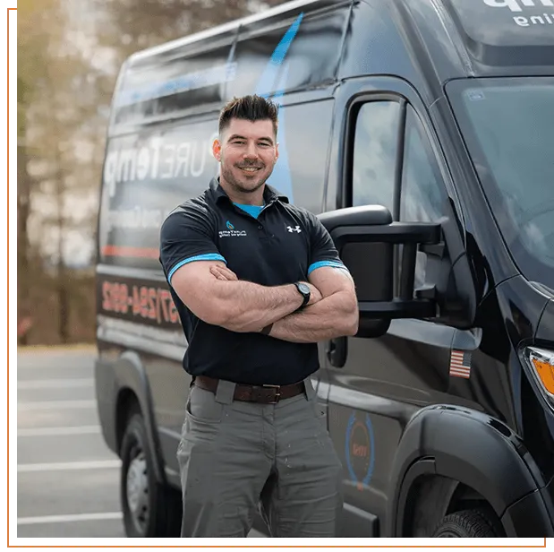 technician standing in front of truck