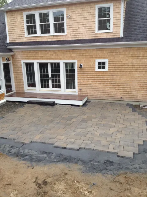 A large house with a patio in front of it