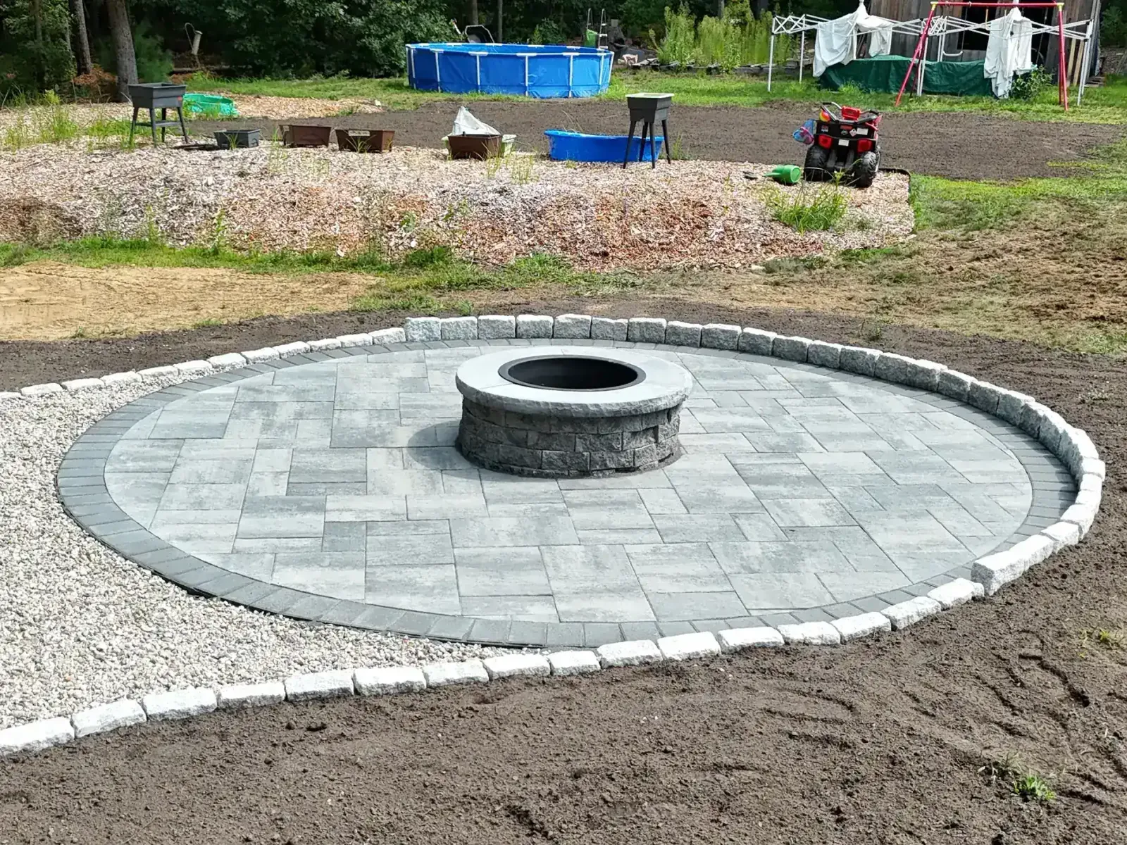 Fire pit patio installation in Kingston, MA by Vincenti Landscaping