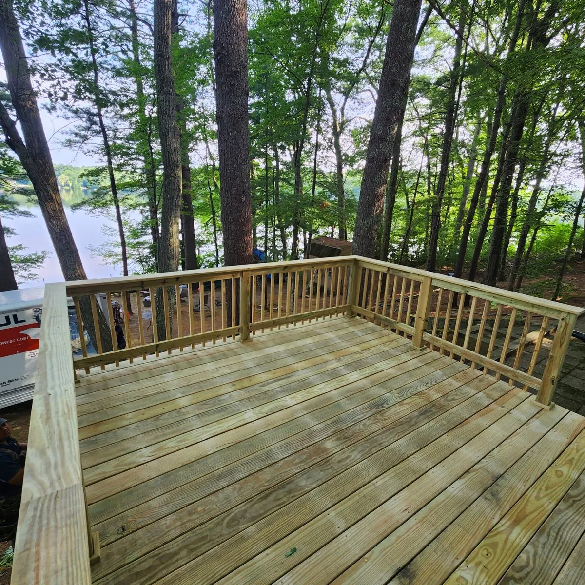 New pressure-treated deck with railing