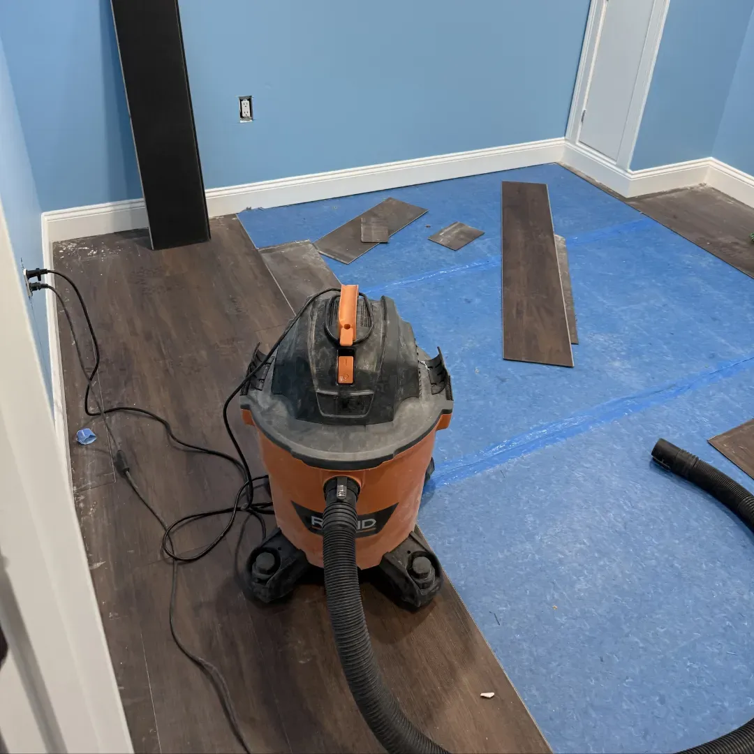Vinyl plank flooring installation with underlayment in Woburn, MA — Tinbercraft Construction