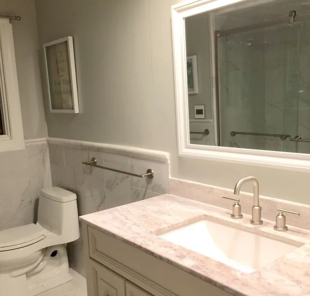 Bathroom remodel: marble vanity and glass shower