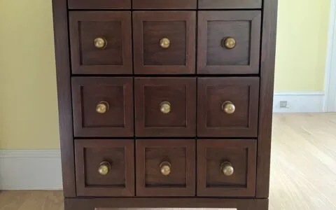 Dark apothecary chest with brass knobs