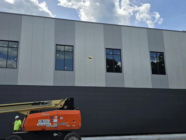 Commercial metal panel building prepared for joint sealing