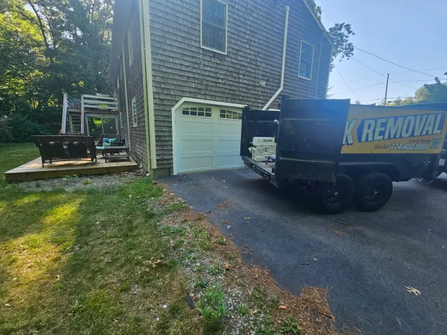 Dumpster rental placement in a tight residential driveway in South Coast