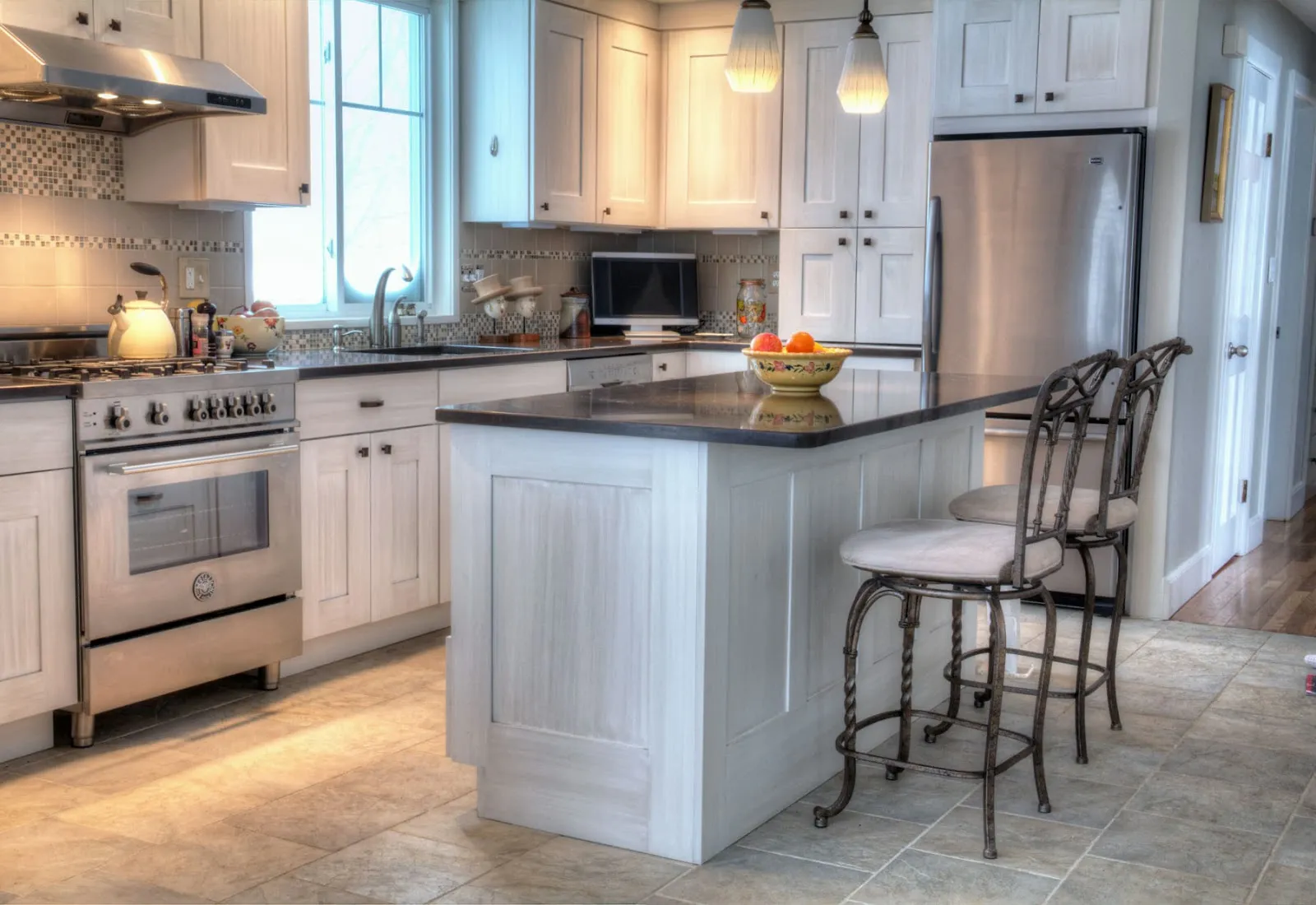 Finished kitchen with island and custom cabinetry