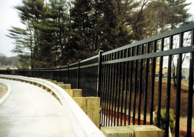 Ornamental fence along a curved concrete ramp