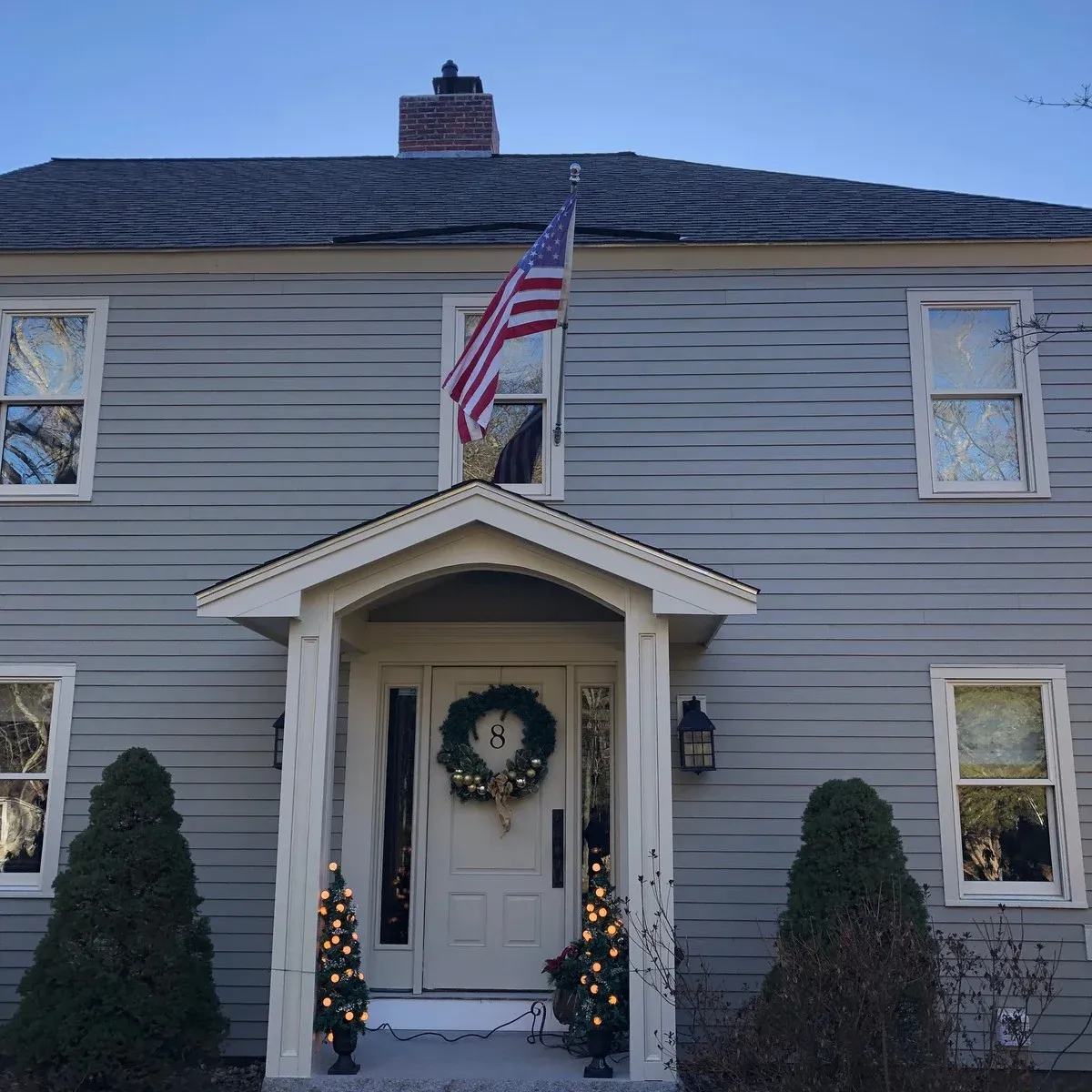 Completed siding and trim on a colonial home
