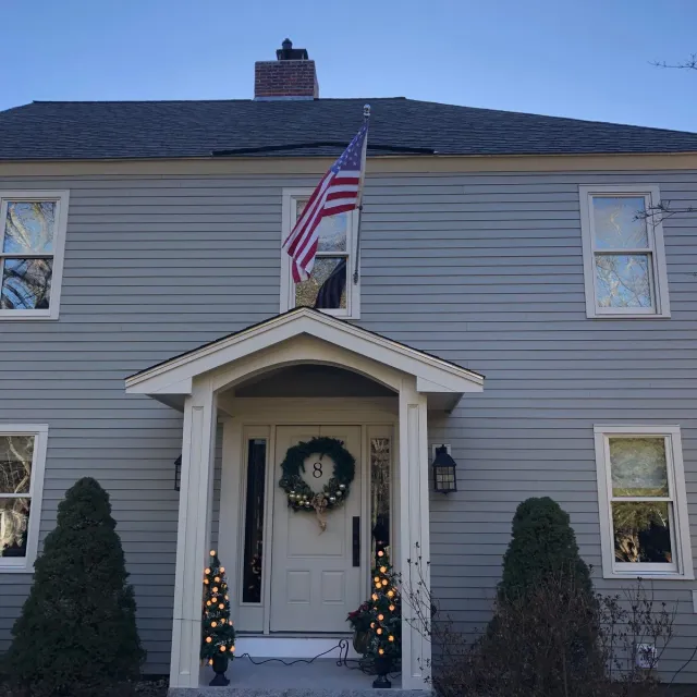 Completed siding and trim on a colonial home