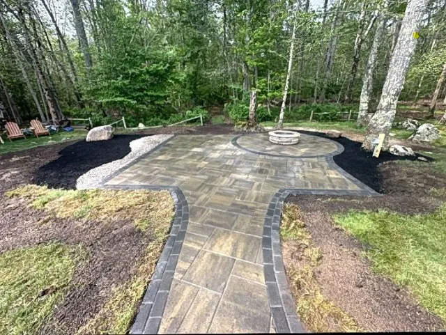 After: Stone paver patio with fire pit and walkway