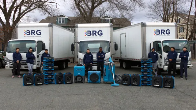 Boston Restoration Group team with branded trucks and professional drying equipment