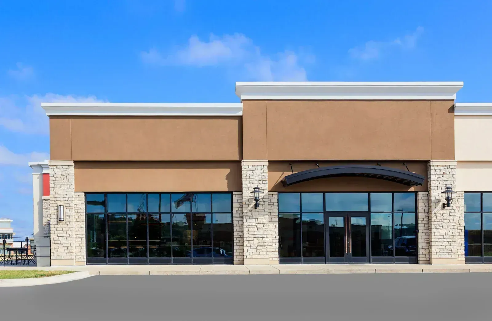 Commercial storefront with glass entrance doors and windows