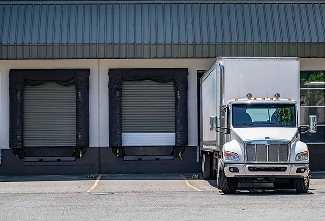 Industrial dock leveler with reinforced seals in Stamford, installed by Ridgefield Door Systems for secure loading
