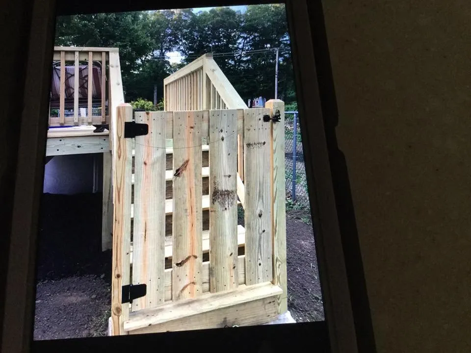 Deck framing and railing under construction