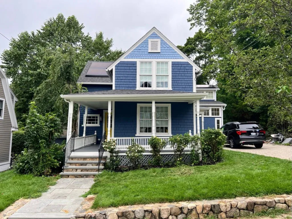 Completed blue shingle home exterior by Gallagher Painting