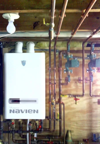 Navien tankless water heater with copper manifold and shutoffs