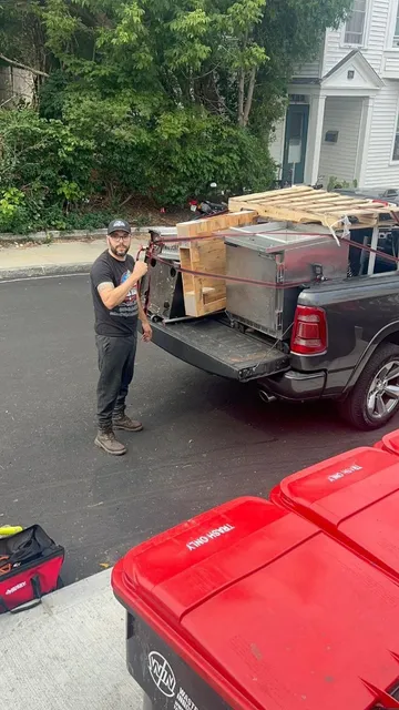 Loaded pickup on a city street after a commercial pickup