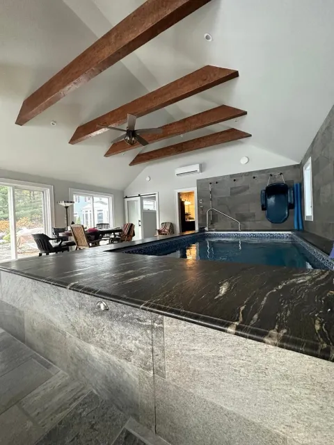 There is a large swimming pool in the middle of the room.