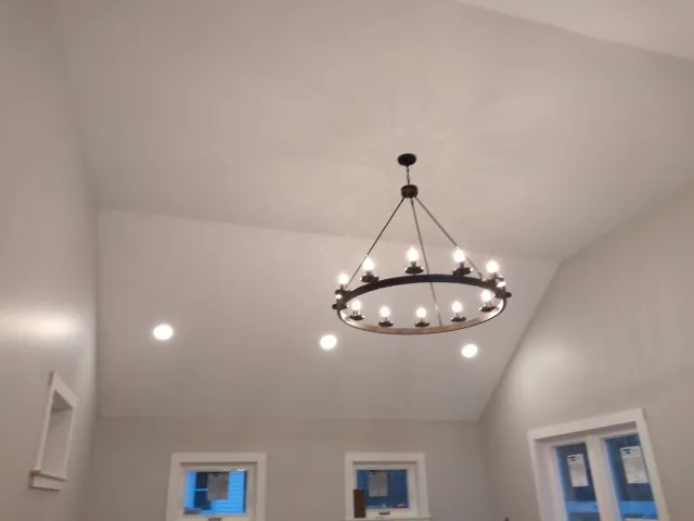 a chandelier hanging from the ceiling of a room