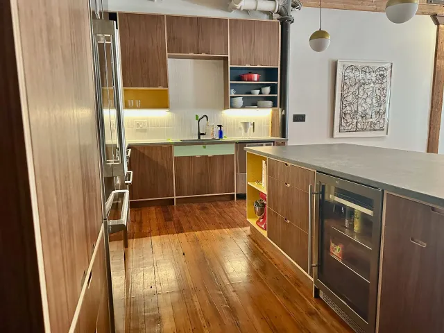 A kitchen with wooden cabinets and stainless steel appliances