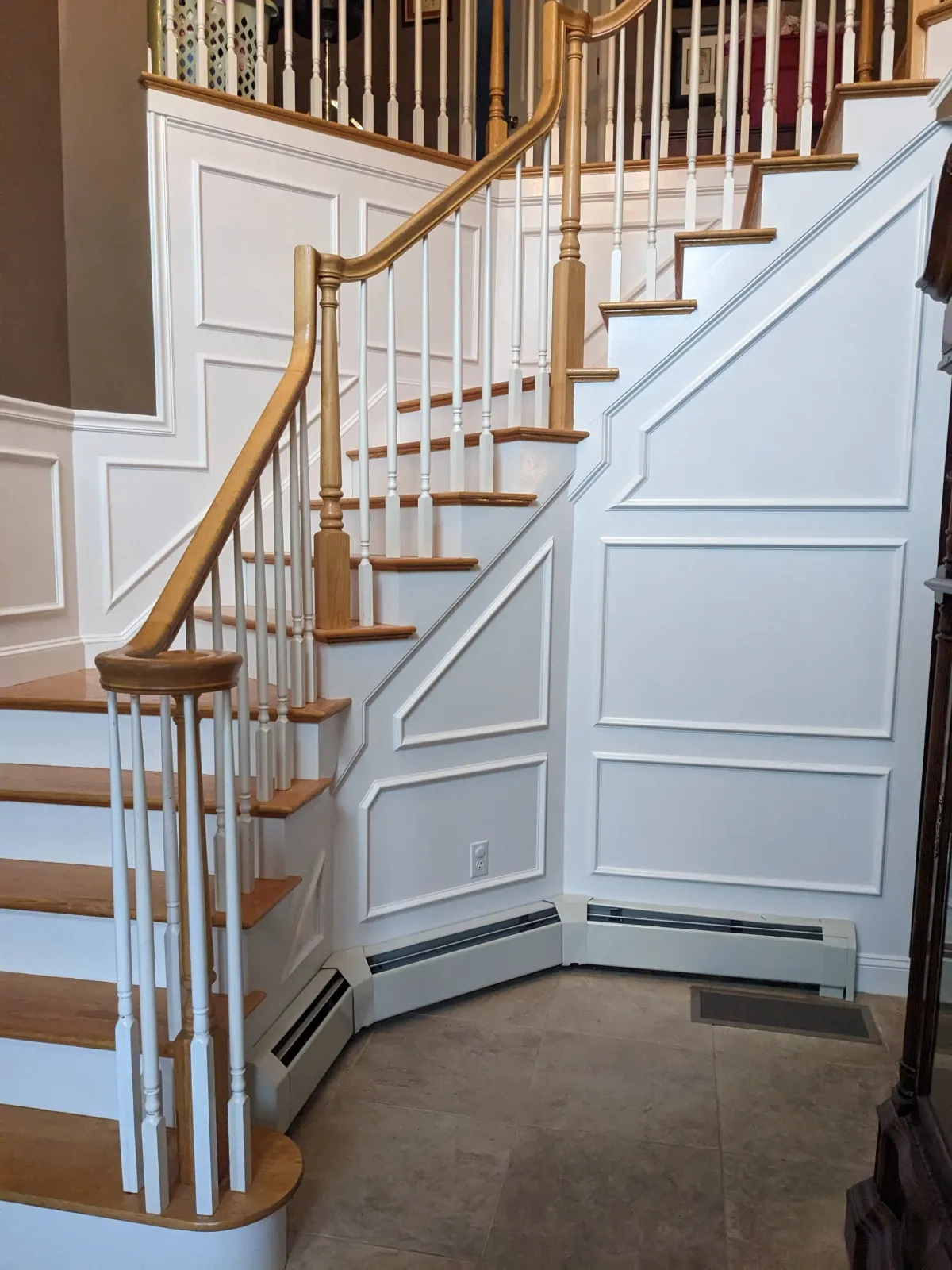 A foyer in Middleborough with professionally installed and painted wainscoting