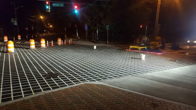 A street with a lot of bricks on it at night