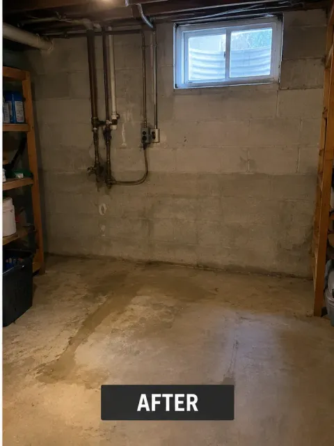 The same basement corner empty after the washer and dryer were removed