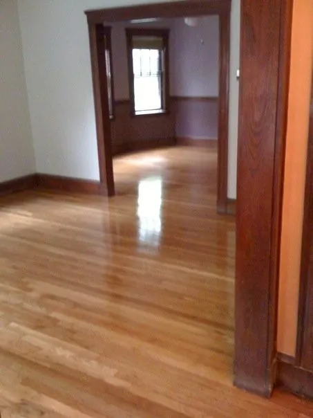 Refinished hardwood floors through a doorway