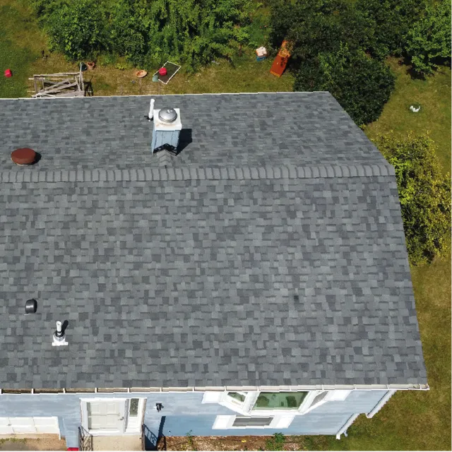 Aerial view of new grey shingle roof on Connecticut ranch home